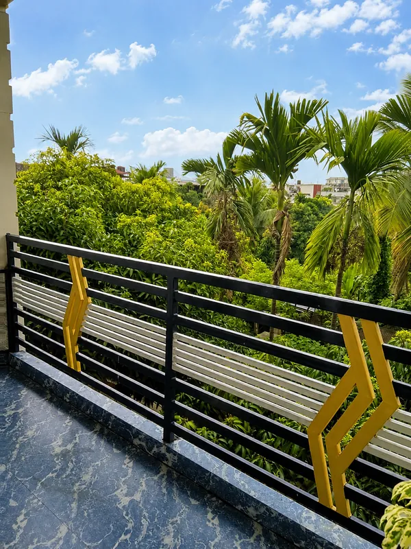 View of palm trees from the Hollong Suite balcony